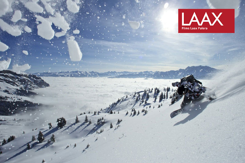 Logo LAAX - Flims Laax Falera Skifahrer Schnee Luft Nebel Alpem
